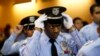  An LAPD Cadet Commander adjusts his hat before the LAPD Cadet Program Graduation of the cadet "Class of 7-2014".