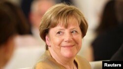 FILE - Former German Chancellor Angela Merkel attends Bellevue Palace for a state banquet in Berlin, Germany, March 29, 2023. 