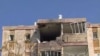 Destruction caused by a rocked fired from Gaza in an apartment building in Kiryat Malachi, southern Israel.