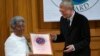 FILE - Mafron Ejigayehu (L) receives the Right Livelihood Award widely known as the Alternative Nobel Prize, on behalf of Catherine Hamlin of Ethiopia, from the founder of the prize journalist and professional philatelist Jakob von Uexkull at a ceremony i
