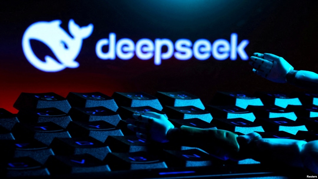 FILE - The Deepseek logo, a keyboard and robot hands are seen in this illustration made Jan. 27, 2025.