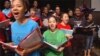 Students at the Duke Ellington School of the Arts in Washington sing during a performance honoring the victims of the 1963 church bombing in Birmingham, Alabama.