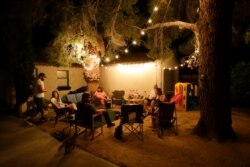 The Hope family, afraid to sleep inside, spends the night outdoors, July 6, 2019, after an earthquake in Ridgecrest, Calif. The Friday evening quake with a magnitude of about 7.1 jolted much of California.