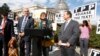 FILE - Rep. Rosa DeLauro, center, joined at left by Rep. Lloyd Doggett, a bloodhound named Roxy, Rep. David Cicilline (r) and other members of Congress, speaks at a news conference on Capitol Hill in Washington, Oct. 29, 2015, about the details of the TPP.