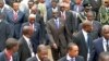 Zimbabwe President Robert Mugabe, center, and fellow regional leaders arrive for 15-nation SADC summit, Maputo, Mozambique, Aug. 17, 2012.