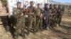 This photo released in a statement by the Pakistani Taliban shows the fighters who stormed a military-run school in Peshawar, Pakistan, Dec. 16, 2014.