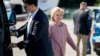 Democratic presidential candidate Hillary Clinton arrives to board her campaign plane at Westchester County Airport, in White Plains, Sept. 15, 2016, to travel to Greensboro, N.C., for a rally. 