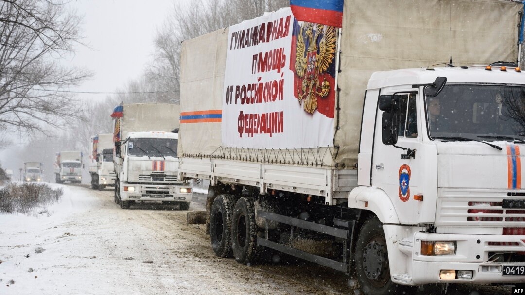 A Russian convoy transporting what Moscow said is humanitarian goods for pro-Russian separatists enters the eastern rebel-held city of Donetsk, Nov. 30, 2014.