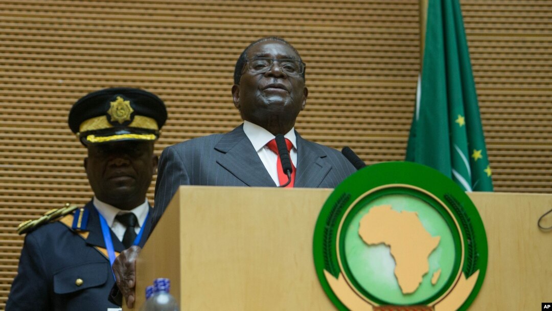 FILE - Zimbabwe president Robert Mugabe delivers a speech during the opening ceremony of the 26 ordinary of the African Union Summit in Ethiopian capital Addis Ababa, Jan. 30, 2016. 