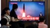  People watch a TV that shows a file picture of a North Korean missile for a news report on North Korea firing short-range ballistic missiles, in Seoul, South Korea, July 31, 2019. 