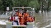 People prepared to disembark after rescuers ferried them across the flooded Hawkesbury River in Windsor, New South Wales, northwest of Sydney on March 25, 2021.