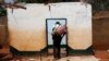A Christian looks for goods to loot in a Muslim house in the PK13 district of Bangui, Central African Republic, Saturday Jan. 25, 2014. Christian Anti-Balaka militias and civilians have virtually flushed all Muslims from the area, looting and dismantling their houses.