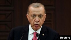 FILE PHOTO: : Turkish President Tayyip Erdogan announces new cabinet during a press conference, in Ankara