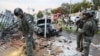 Israeli policemen and rescue personnel search the site of a rocket attack from Gaza in Beitar Illit, a town in the Gush Etzion settlement cluster in the occupied West Bank, on October 9, 2023.