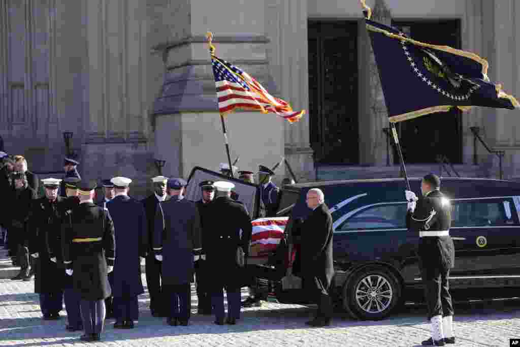 The hearse carrying the flag-draped casket of former President Jimmy Carter arrives at Washington National Cathedral in Washington, Jan. 9, 2025, for a State Funeral. 
