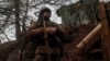 A Ukrainian service member stands on the front line near the city of Novoluhanske in the Donetsk region, Feb. 22, 2022. 
