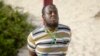 Hassan Hanafi Haji, a former journalist accused of belonging to al-Shabab and involvement in the killings of five Somali journalists, is tied to a wooden post as he is prepared to be executed by firing squad, at a police academy in the capital Mogadishu on April 11, 2016. 