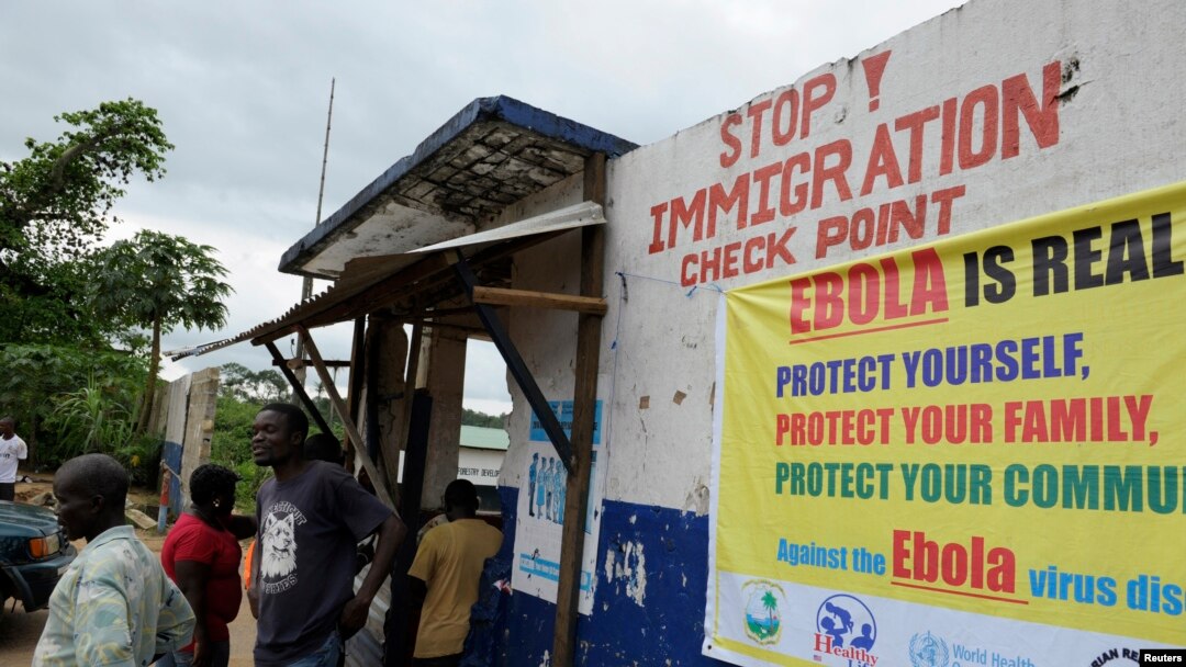 Liberian soldiers stop people at an Ebola checkpoint in Bomi County, Aug. 11, 2014.