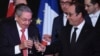 Cuban President Raul Castro, left, and French President Francois Hollande raise a glass during a state diner at the Elysee Presidential Palace in Paris, France, Feb. 1, 2016. 