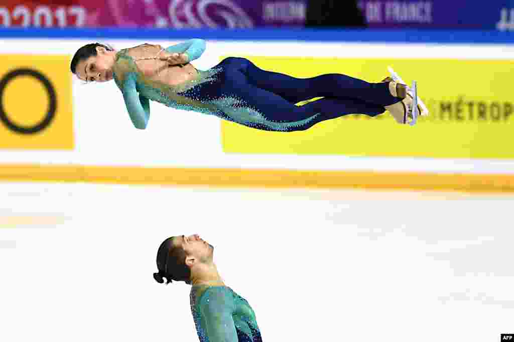 Italy's Nicole Della Monica and Matteo Guarise compete in the Pair Free Skating during the Internationaux de France ISU Grand Prix of Figure Skating in Grenoble, central-eastern France, Nov. 18, 2017.