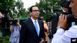 Treasury Secretary Steven Mnuchin speaks with reporters at the White House in Washington, June 27, 2018. 