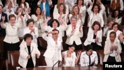 FILE - Democratic female members of Congress cheer after President Donald Trump said there are more women in Congress than ever before, during his second State of the Union address to a joint session of Congress at the U.S. Capitol in Washington, Feb. 5, 2019.