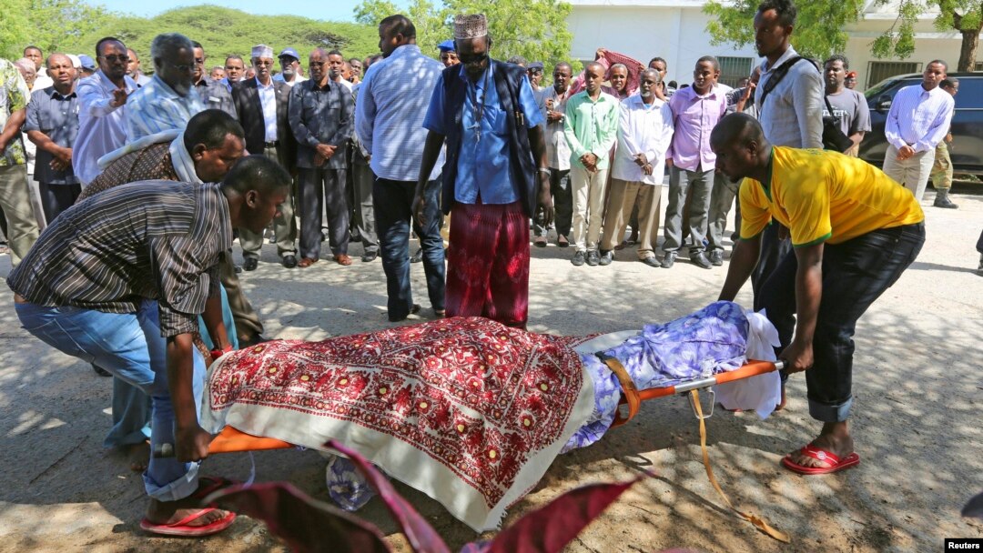 Members of the parliament and relatives carry the body of slain legislator Mohamed Mohamud Hayd who was shot dead in the Hamarweyne district of Mogadishu, Somalia, July 3, 2014. 