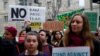 Immigration activists rally against the Trump administration's revised ban against travelers from six Muslim-majority nations, outside of the U.S. Customs and Border Protection headquarters in Washington, March 7, 2017.