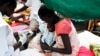 FILE - A medical staff attends to a malnourished child at a Medecins Sans Frontieres hospital in a displaced-persons camp inside the U.N. base in Malakal, South Sudan, July 24, 2014. 