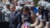 President Barack Obama and first lady Michelle Obama arrive for a memorial ceremony, Wednesday, April 9, 2014.