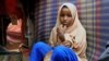 FILE - Nurta Mohamed, 13, of Somalia sits inside her mother's makeshift shelter after running away from a suspected forced marriage in the Garasbaaley district of Mogadishu, Somalia, Aug. 14, 2020.