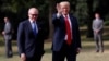 U.S. President Donald Trump waves next to U.S. Ambassador to U.K. Woody Johnson as he leaves the ambassador's residence, in London, July 13, 2018.