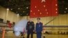 Turkey's President Recep Tayyip Erdogan poses for a photo with a Turkish army commander in front of a drone at a military airbase in Batman, Turkey, Saturday, Feb. 3, 2018.