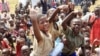Refugee children, displaced by continued fighting in north Kivu province in the Democratic Republic of Congo (DRC), play at the Nyakabande refugee transit camp in Kisoro, Uganda, July 13, 2012.