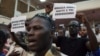 Supporters of presidential candidate Soumaila Cisse sing their political party anthem at a meeting in Bamako, July 31, 2013.