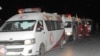 A photo released by the Syrian official news agency SANA, shows members of the Syrian Arab Red Crescent gathering near their ambulances during an evacuation of sick and wounded people from eastern Ghouta, near Damascus, Syria, Dec. 28, 2017. 
