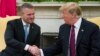 President Donald Trump shakes hands with Slovak Prime Minister Peter Pellegrini during a meeting in the Oval Office of the White House, May 3, 2019, in Washington.