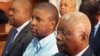 Ndambi Guebuza (meio) e Armando Guebuza (esquerda)