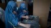 Afghan women cast their ballots at a polling station in Kabul, Afghanistan, April 5, 2014.