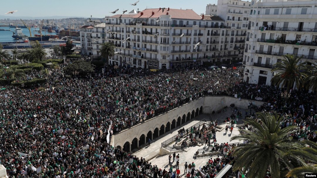 People gather during a protest over President Abdelaziz Bouteflika's decision to postpone elections and extend his fourth term in office, in Algiers, Algeria March 15, 2019.