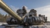 FILE - A Ukrainian tank crew takes part in a training exercise that focuses on fighting sabotage groups, in the Chernihiv region, Dec. 5, 2023, during the Russian invasion of Ukraine.