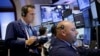 Traders work on the floor at the New York Stock Exchange in New York, July 8, 2015. (AP)
