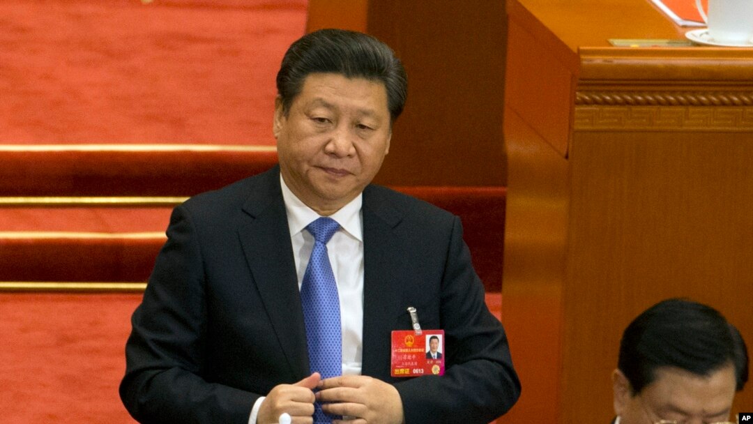 FILE - Chinese President Xi Jinping attends the closing session of the annual National People's Congress in Beijing's Great Hall of the People, March 16, 2016. 