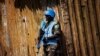 FILE - A Nigerian United Nations peacekeeper stands guard at a rally for incumbent Liberian President Ellen Johnson-Sirleaf in Monrovia.
