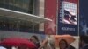 Convention goers use umbrellas to dodge the rain while arriving to the site of the Republican National Convention in Tampa, Florida, August 26, 2012. 