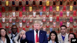 President Donald Trump speaks during a ribbon-cutting ceremony at a Louis Vuitton workshop near Alvarado, Texas, Oct. 17, 2019. 