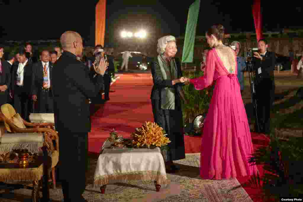 American actress Angelina Jolie is being greeted by Cambodia's Queen Mother Norodom Monineath and King Norodom Sihamoni at an outdoor world premiere of "First They Killed My Father" near Angkor Wat in Siem Reap, Cambodia, February 18, 2017. (Amanda Boury/Netflix)