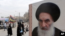Iroqda shialar diniy rahnamosi Oyatulla Ali al-Sistaniyning surati 