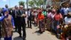 FILE - Turkey's President Recep Tayyip Erdogan and his wife, Emine Erdogan, greet local people during a ceremony in Maputo, Mozambique, Jan. 24, 2017. 