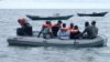 FILE - Cameroonian coast guardsmen and marines are seen in a rescue boat near the port town of Kribi, Cameroon. Thirty-two people, most of them Cameroonian soldiers, remain unaccounted for after their ship sank off the coast of the Bakassi Peninsula over a week ago.